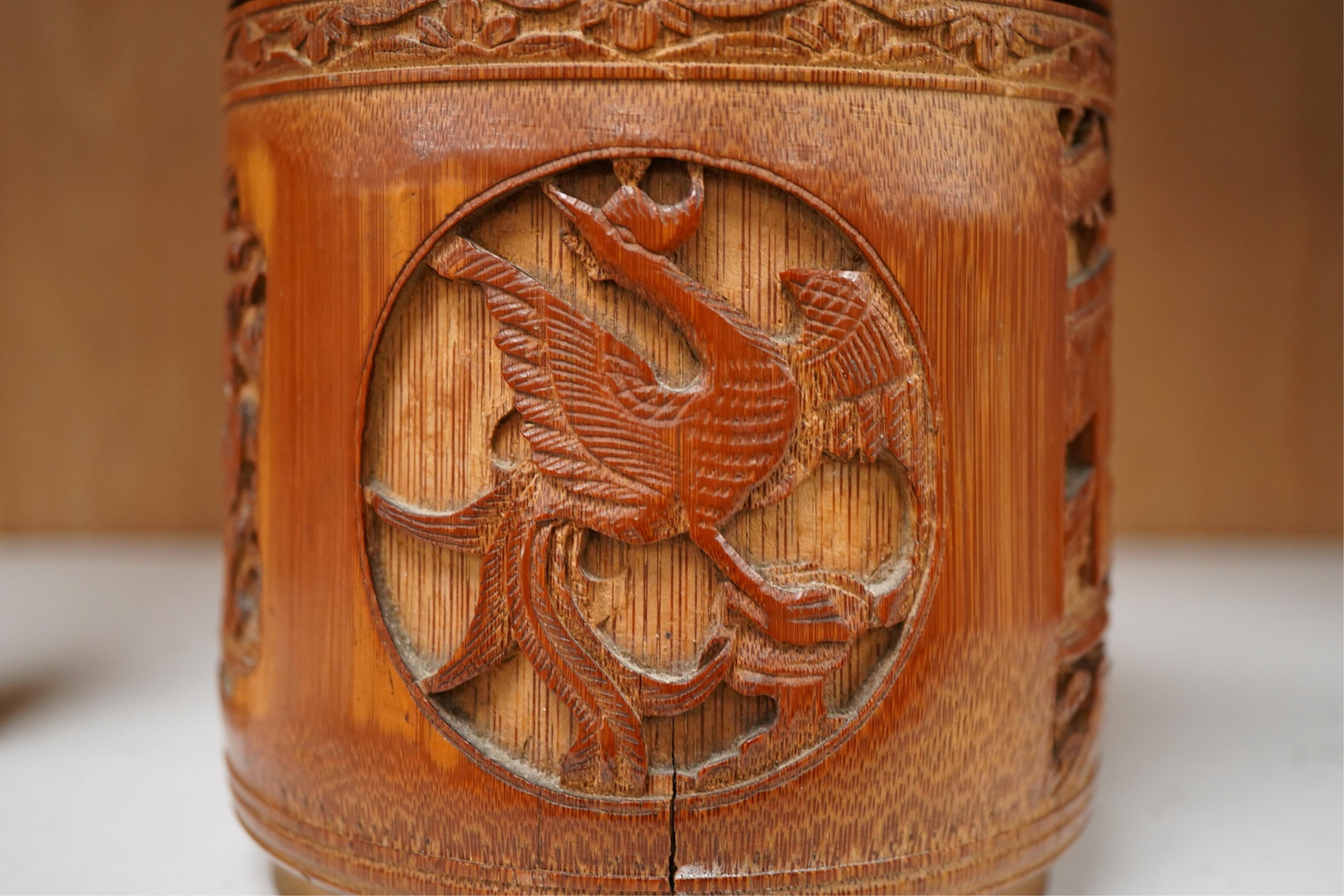 A Chinese carved bamboo tobacco jar and cover, 15cm high